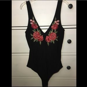 Black with flowers body suit